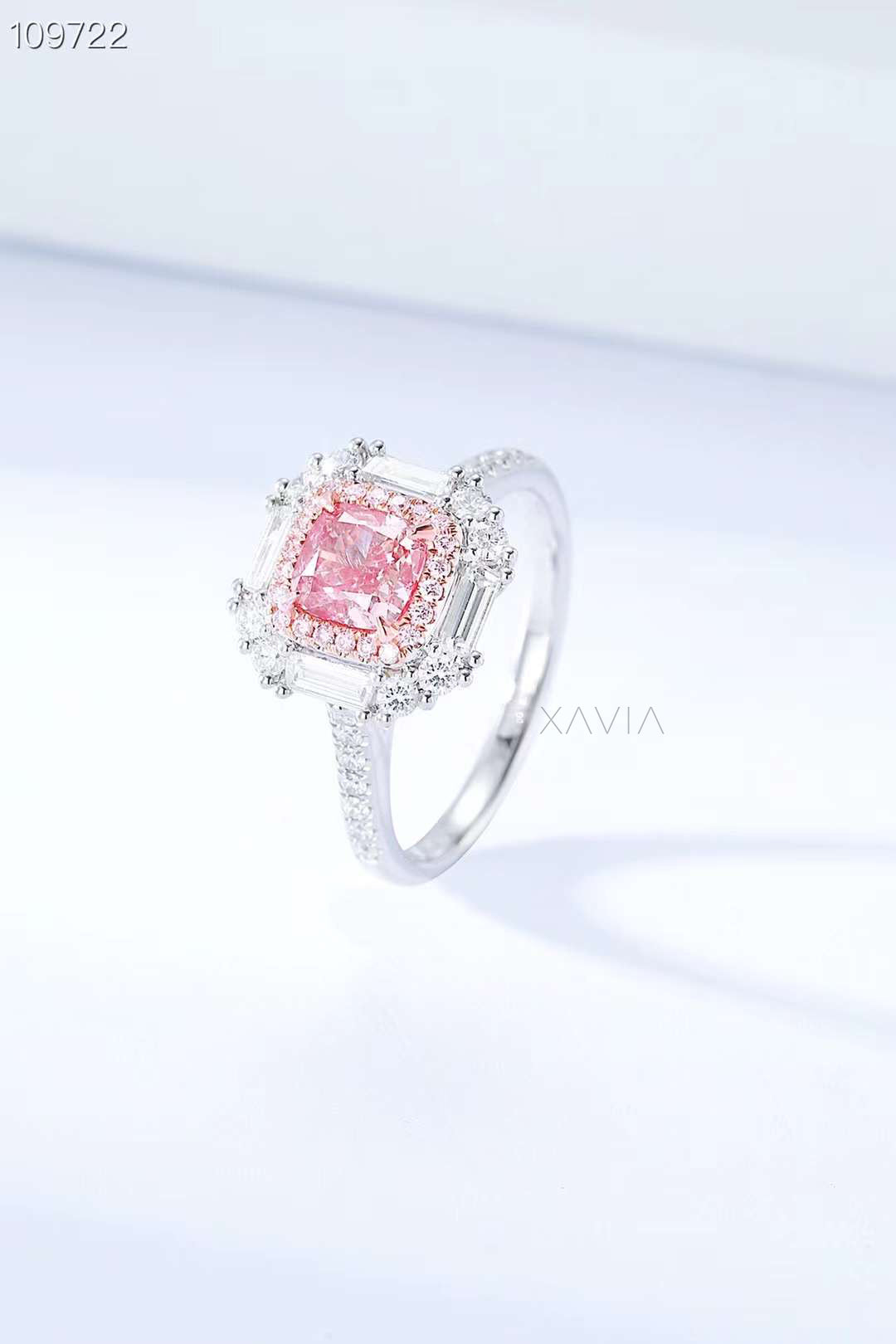 angled view of pink lab-grown cushion diamond ring with halo setting